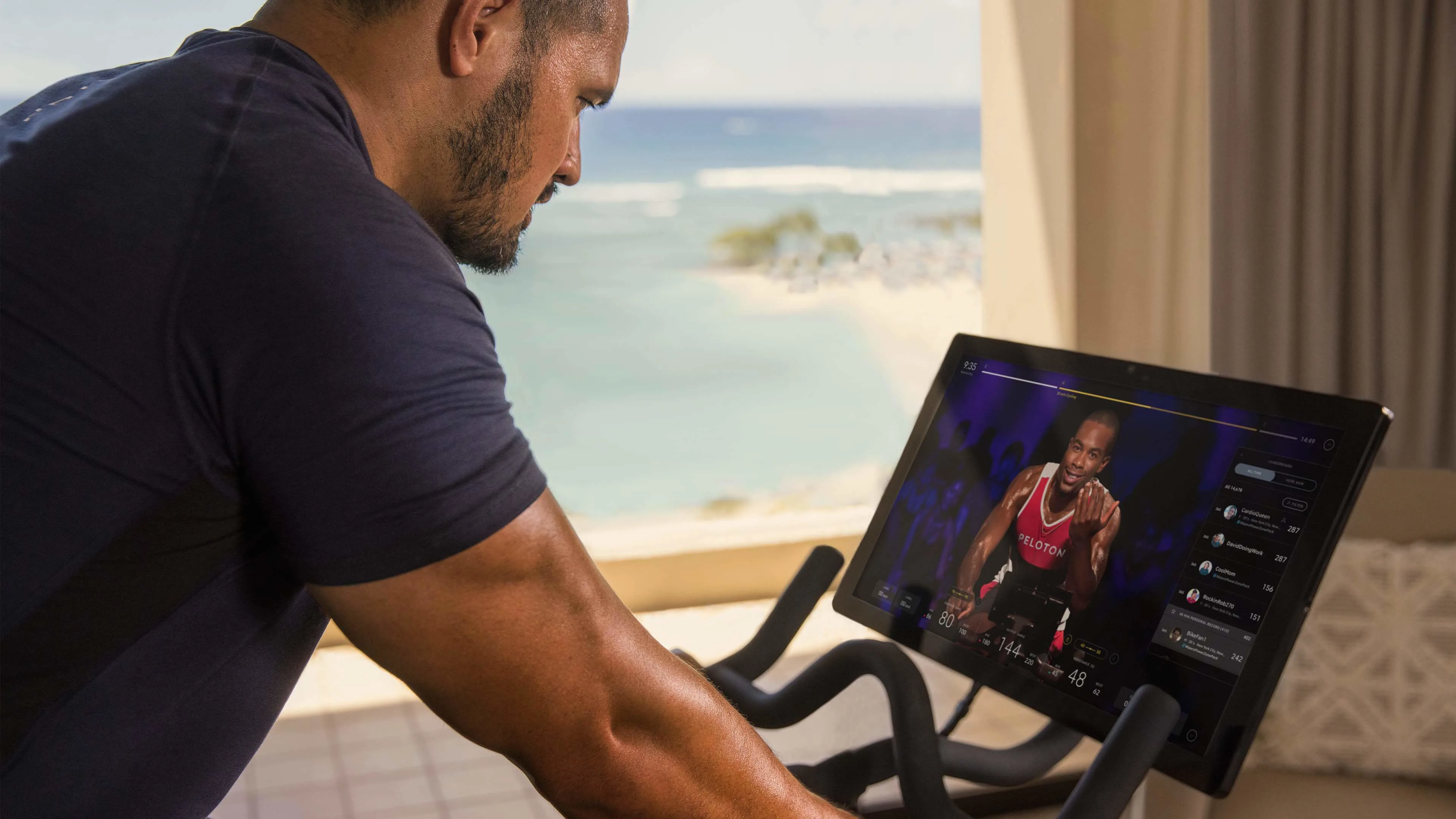 Exerciser using a Peloton stationary bike at a hotel in Hawaii