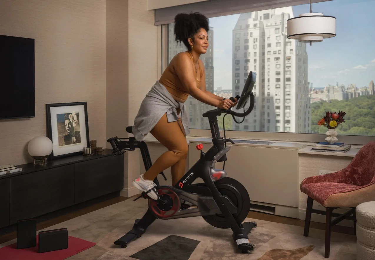 Hotels guest exercising on a Peloton Bike