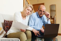 Couple looking at their will online