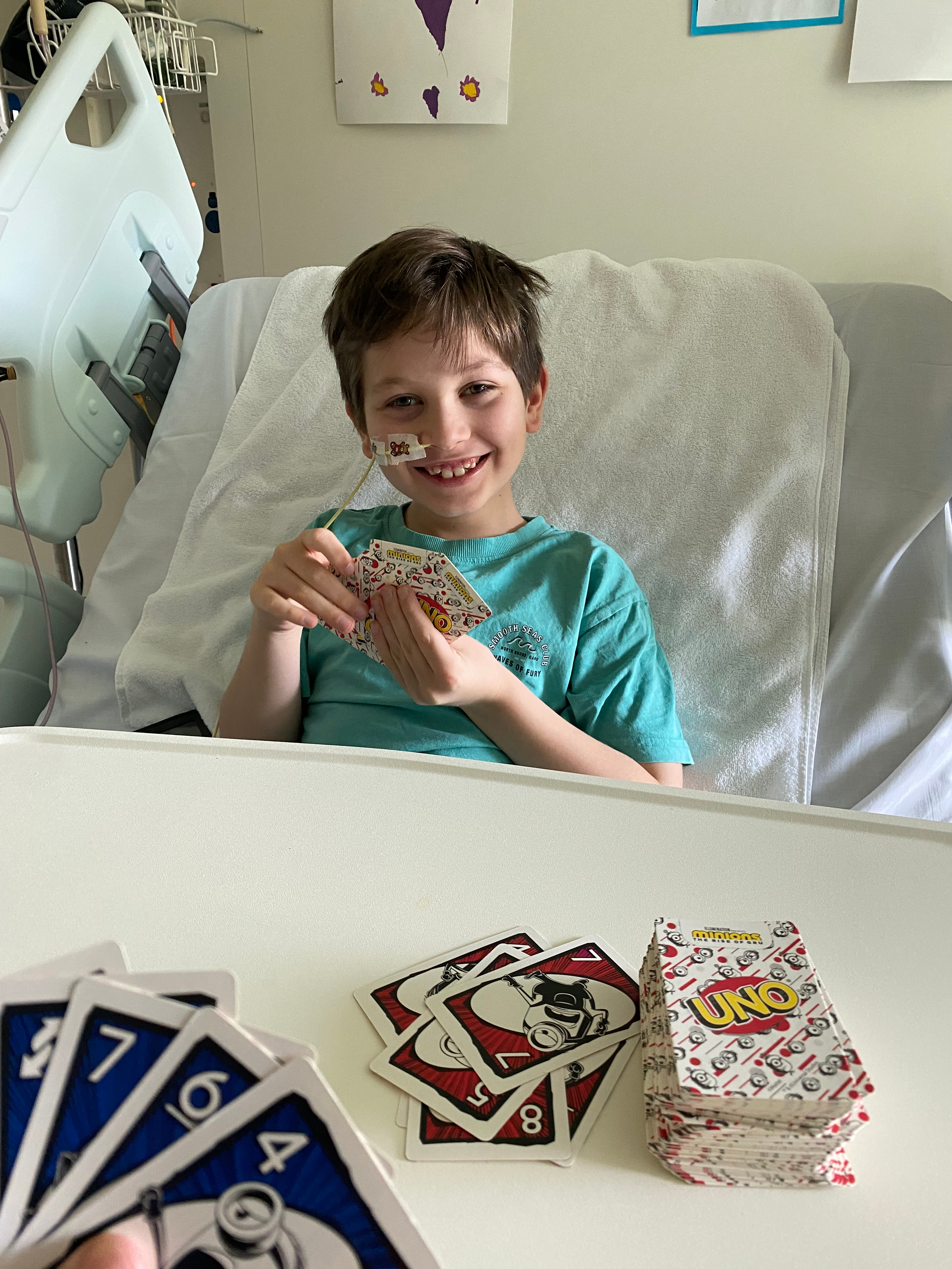 Jace in hospital bed smiling