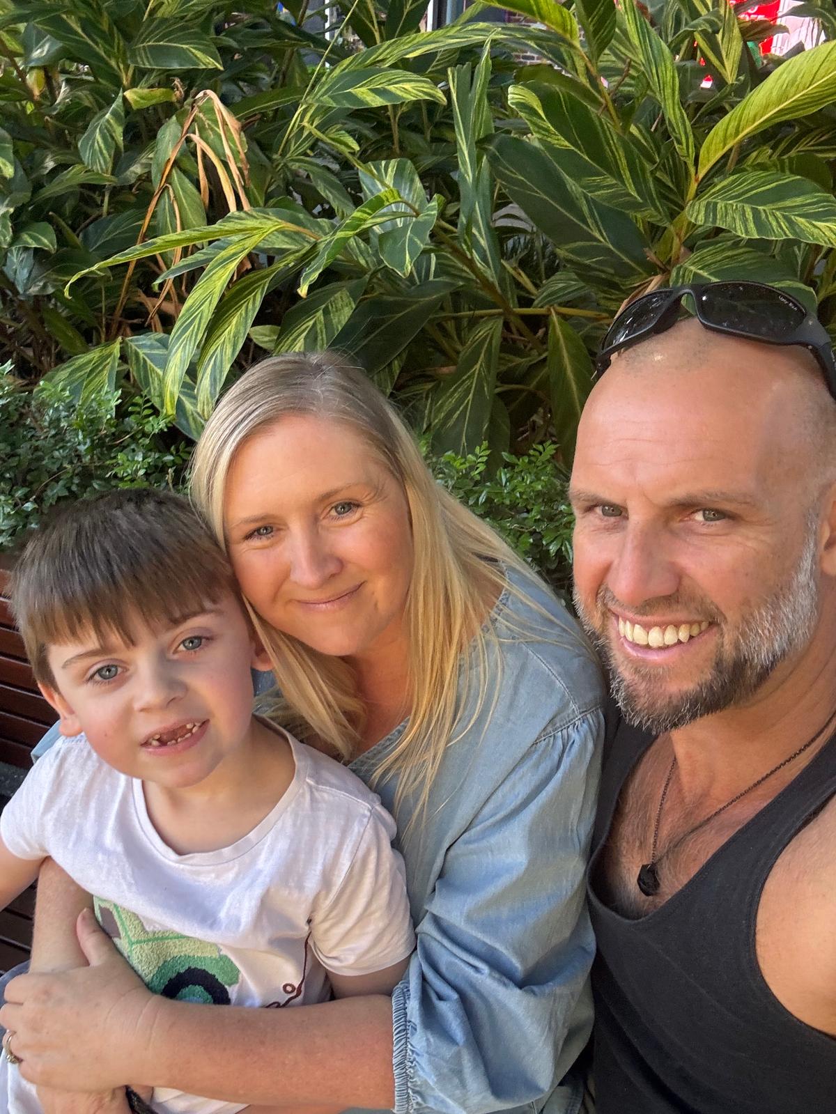 Ash with parents