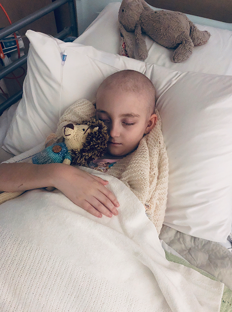 Emily asleep in hospital bed
