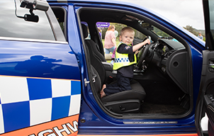 Eden in police car - card
