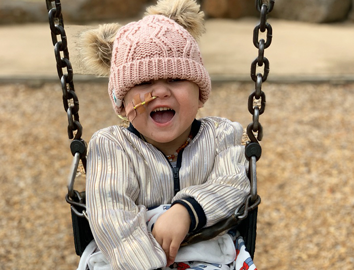 Ava on swings - banner