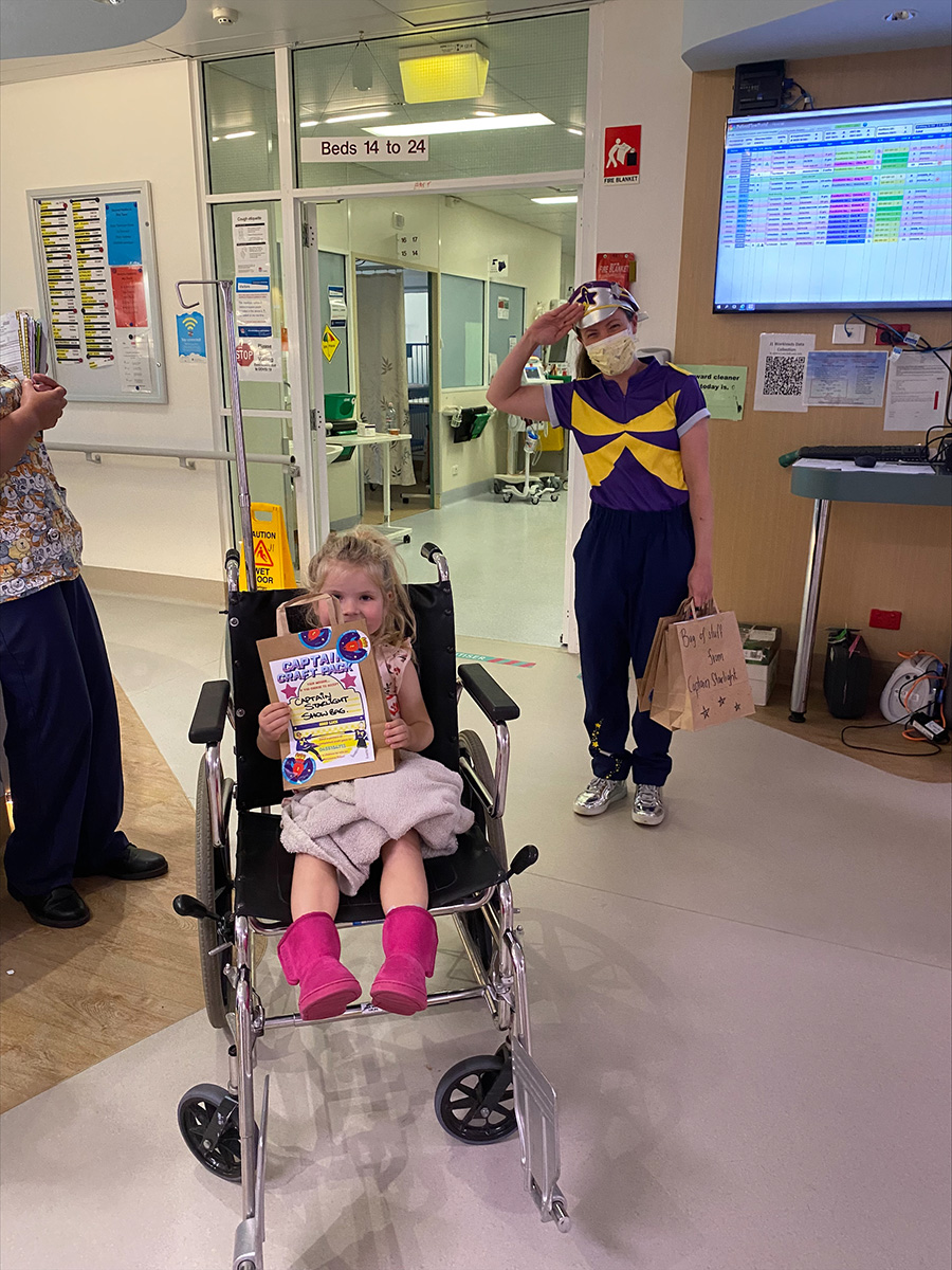 Roxy in wheelchair with Captain Starlight