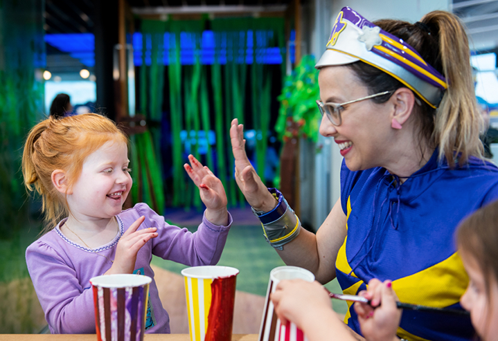 Nora and Captain Starlight high-five