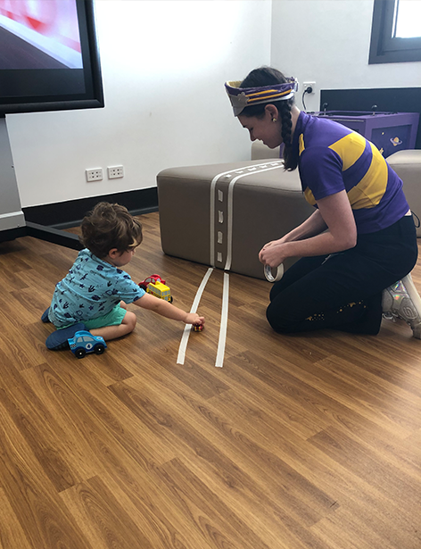 Bertie playing cars with Captain Starlight