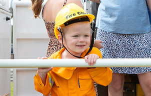 Eden in fireman outfit - card