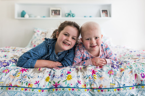 Paige and her sister at home