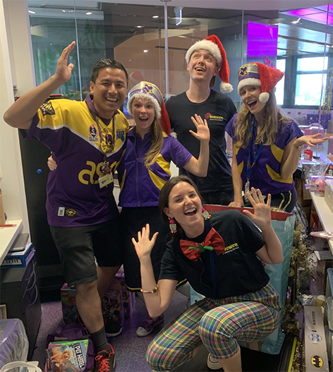 Volunteer Hien with Captain Starlight and Livewire facilitators