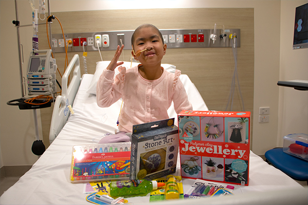 Nia in hospital with surprise pack