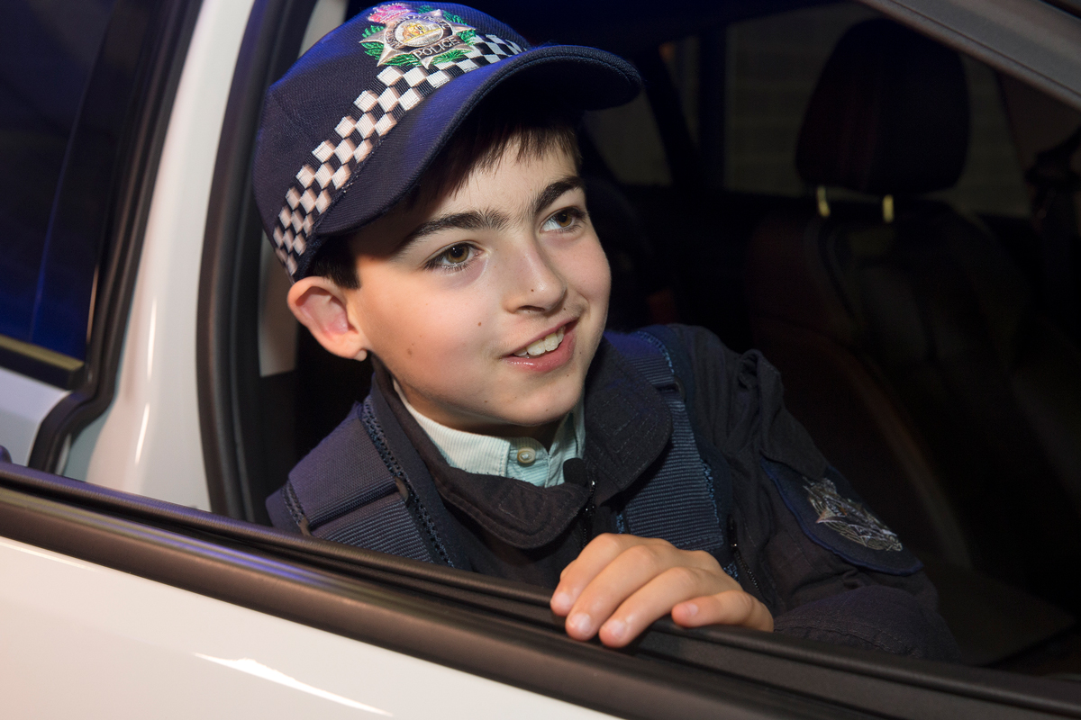 Syel in police car