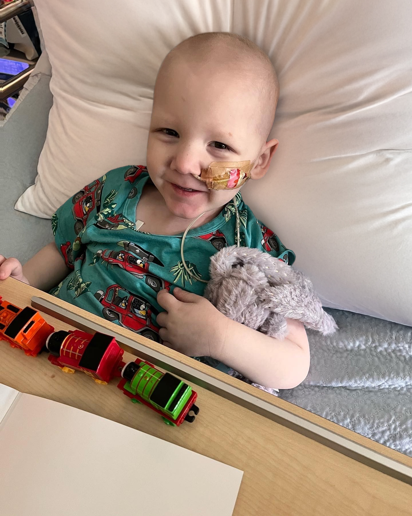 Liam smiling in hospital bed