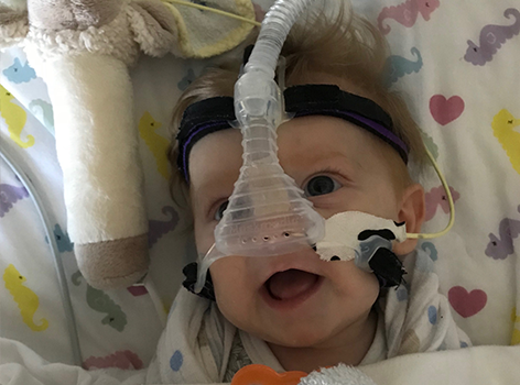 Ellie wearing mask in hospital