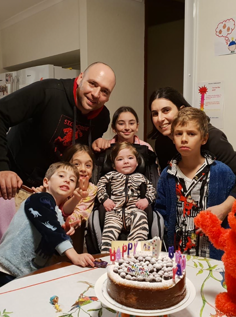 Em with family during birthday celebration
