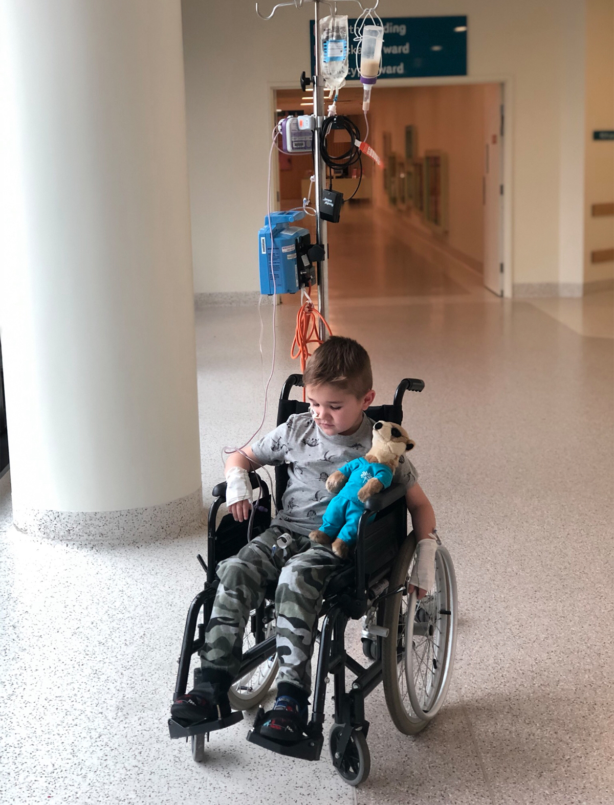 Chayse in wheelchair looking down
