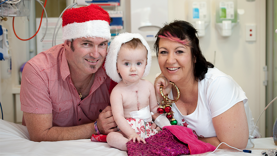 Abigail and her parents in hospital during Christmas