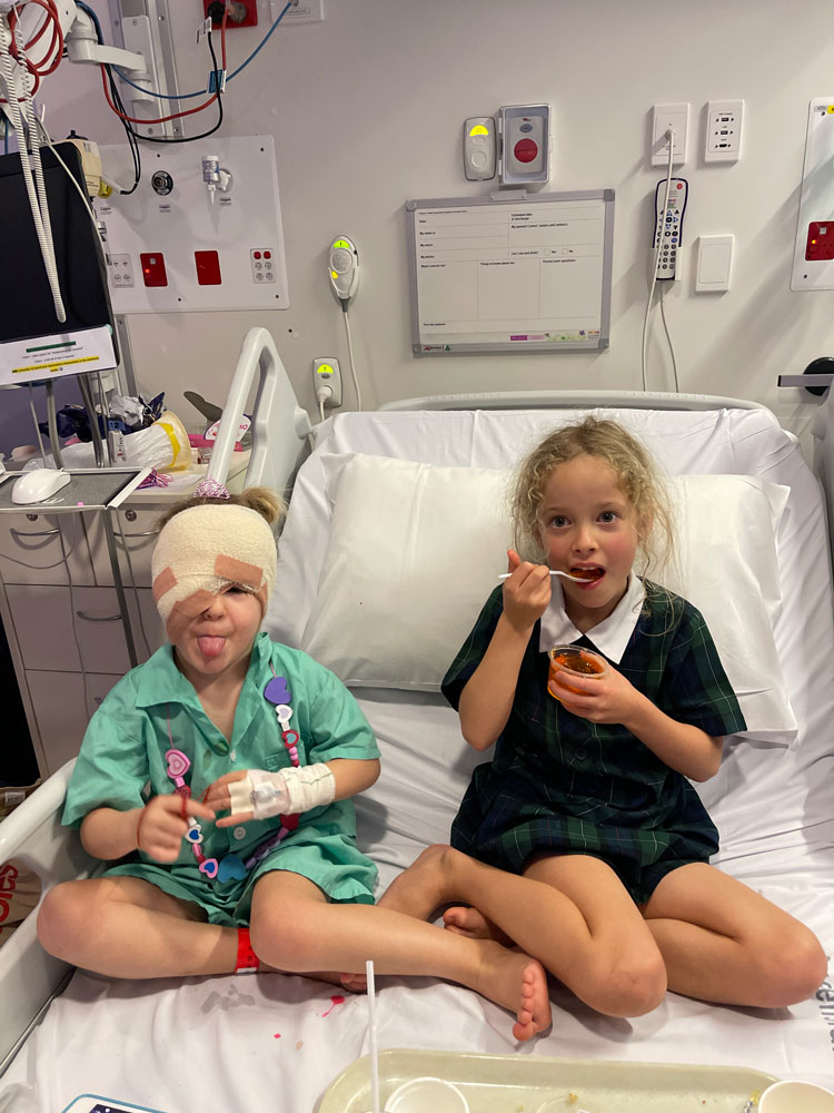 Lotte with her sister in hospital bed
