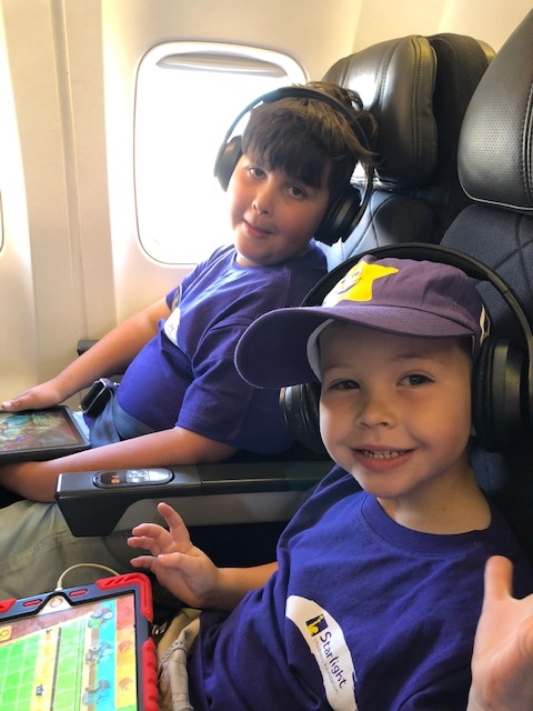 Logan on plane on his way to Starlight Wish