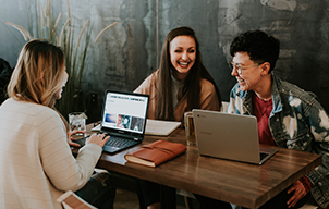 Young people on laptop stock image - card