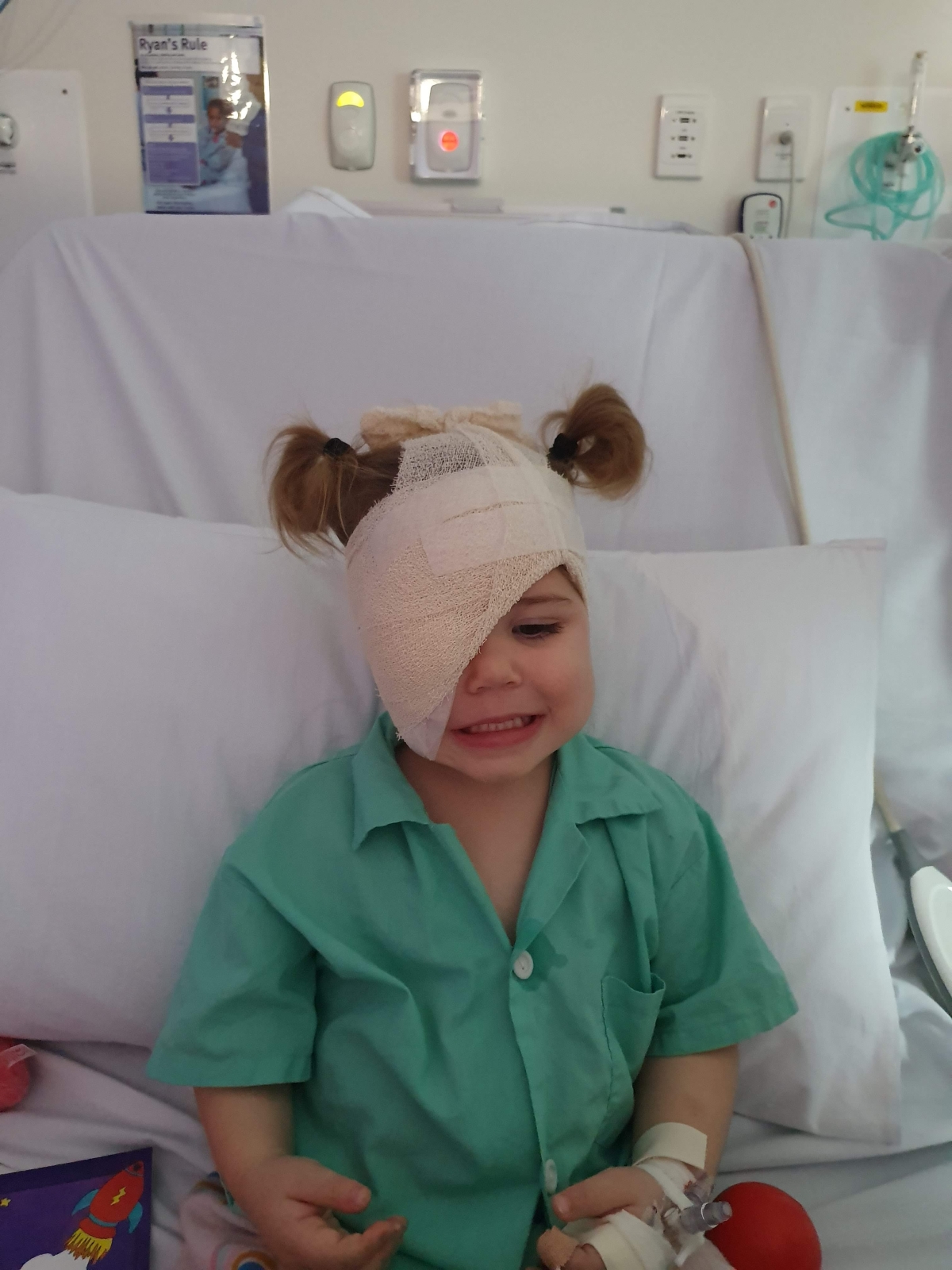 Thea with head bandaged