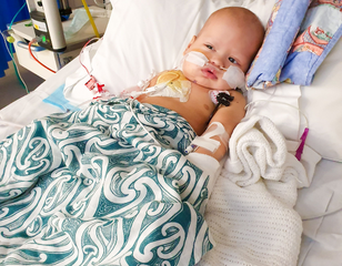 Mason sick in hospital bed 308 x 240
