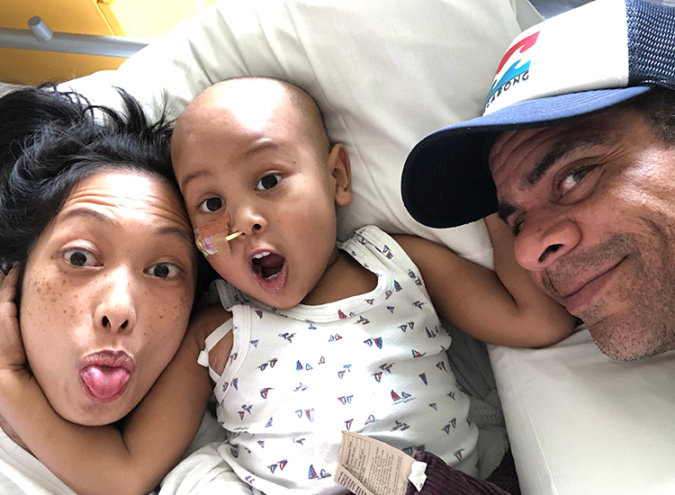 Taiyo in hospital with his parents