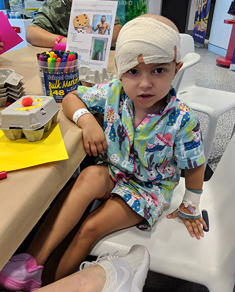 Ava doing craft in the Starlight Express Room