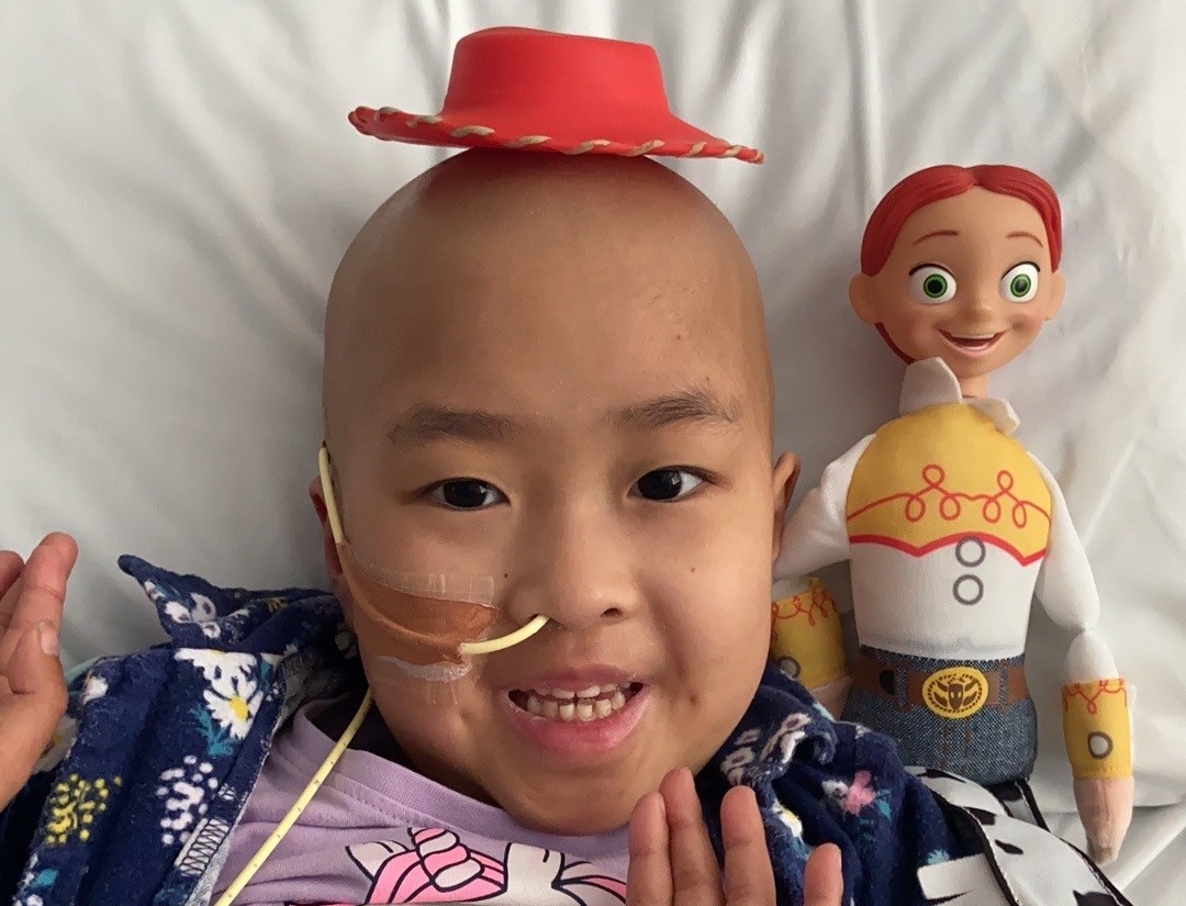 Nia in hospital with Jessie doll