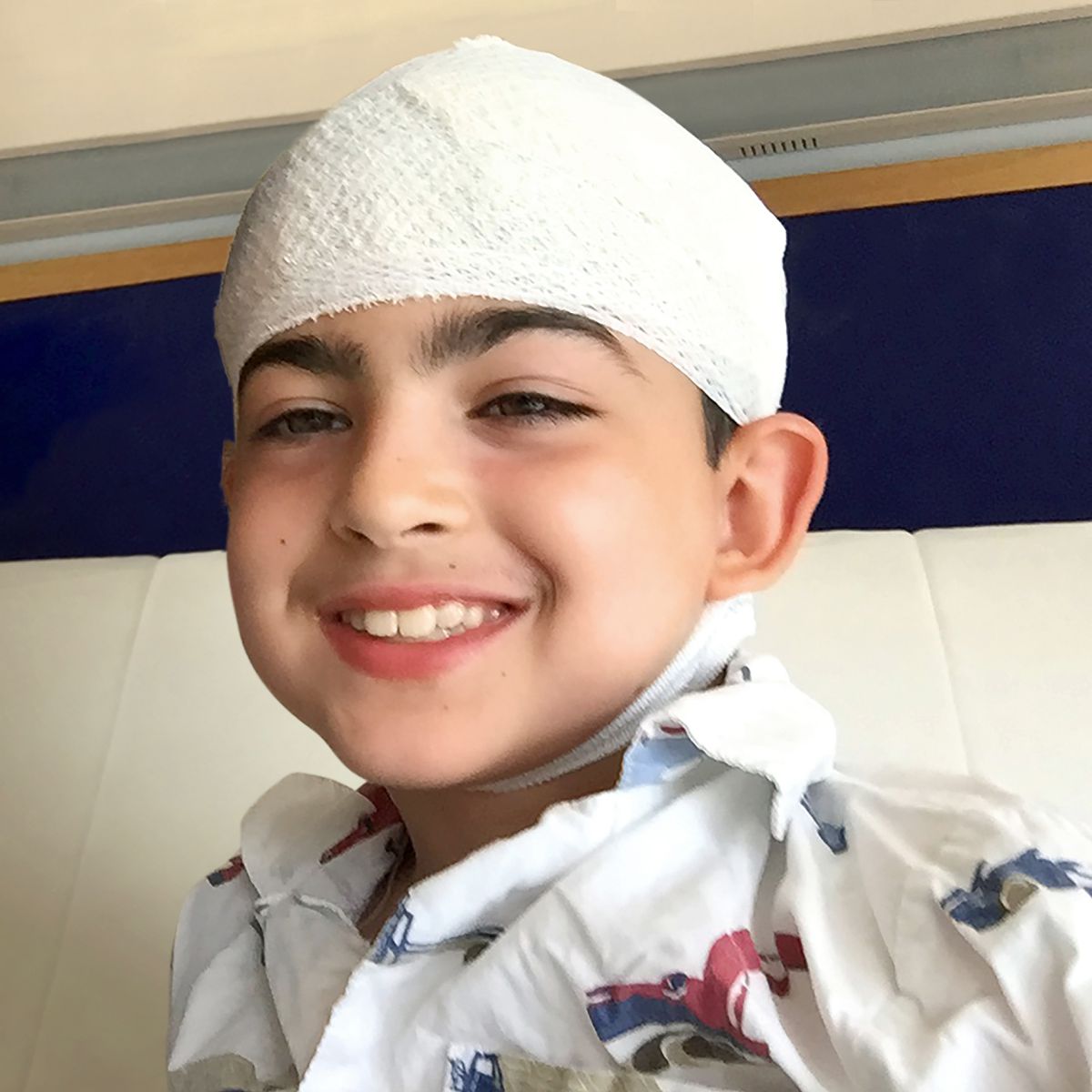 Syel with bandage on head