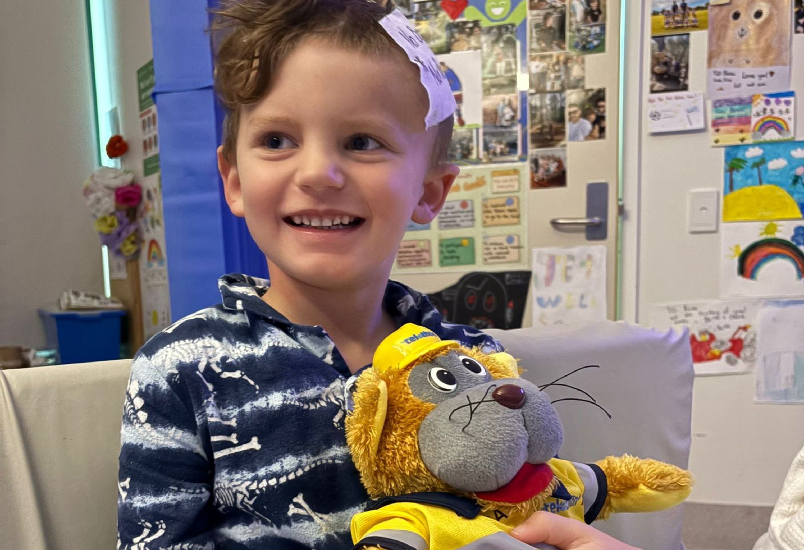 Beau smiling with teddy
