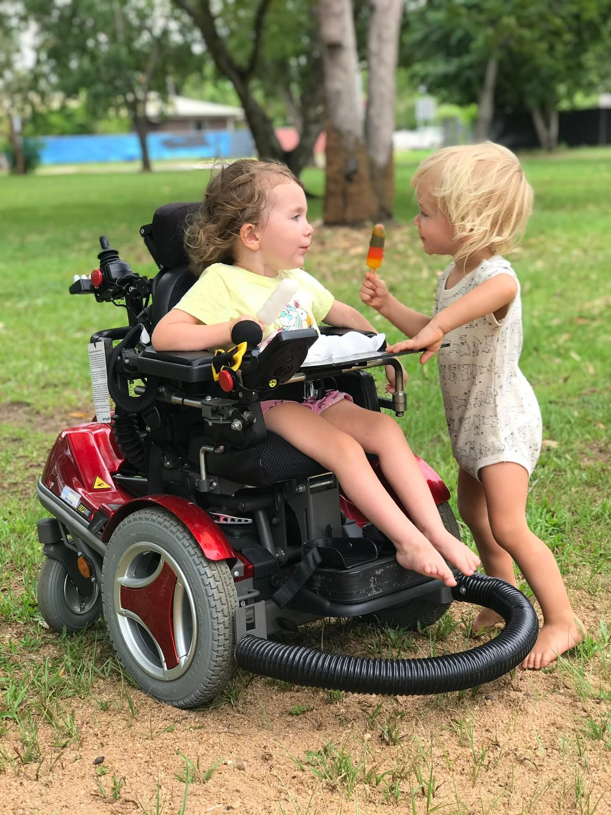 Avi and her brother outside