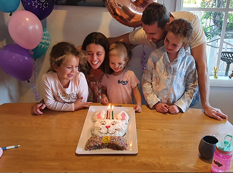 Chloe and family celebrating a birthday