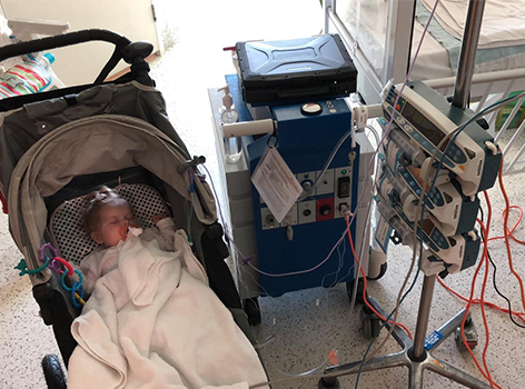 Ellie sleeping in pram at hospital