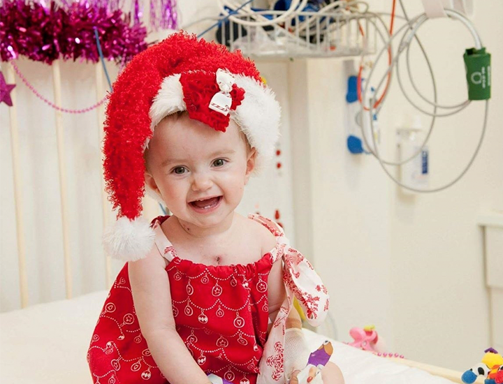 Abigail as a baby in hospital during Christmas