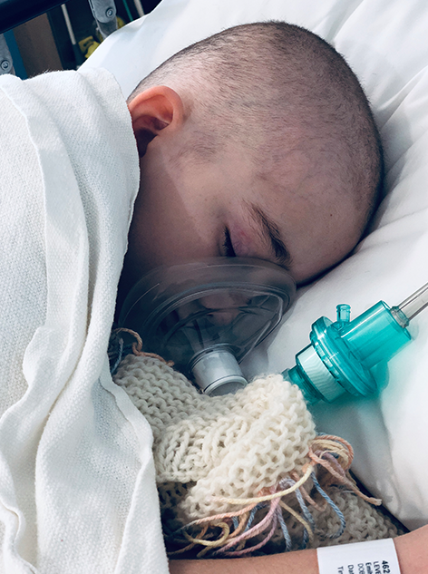 Emily sleeping in hospital bed