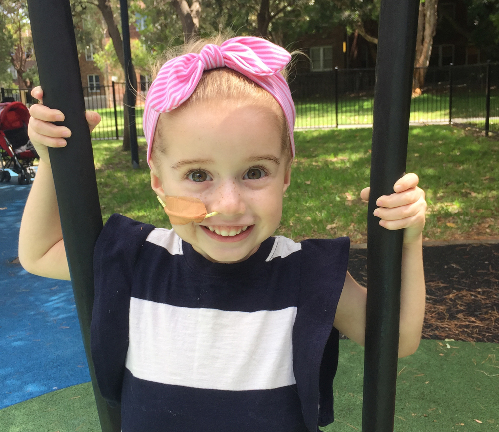 Addy smiling in park