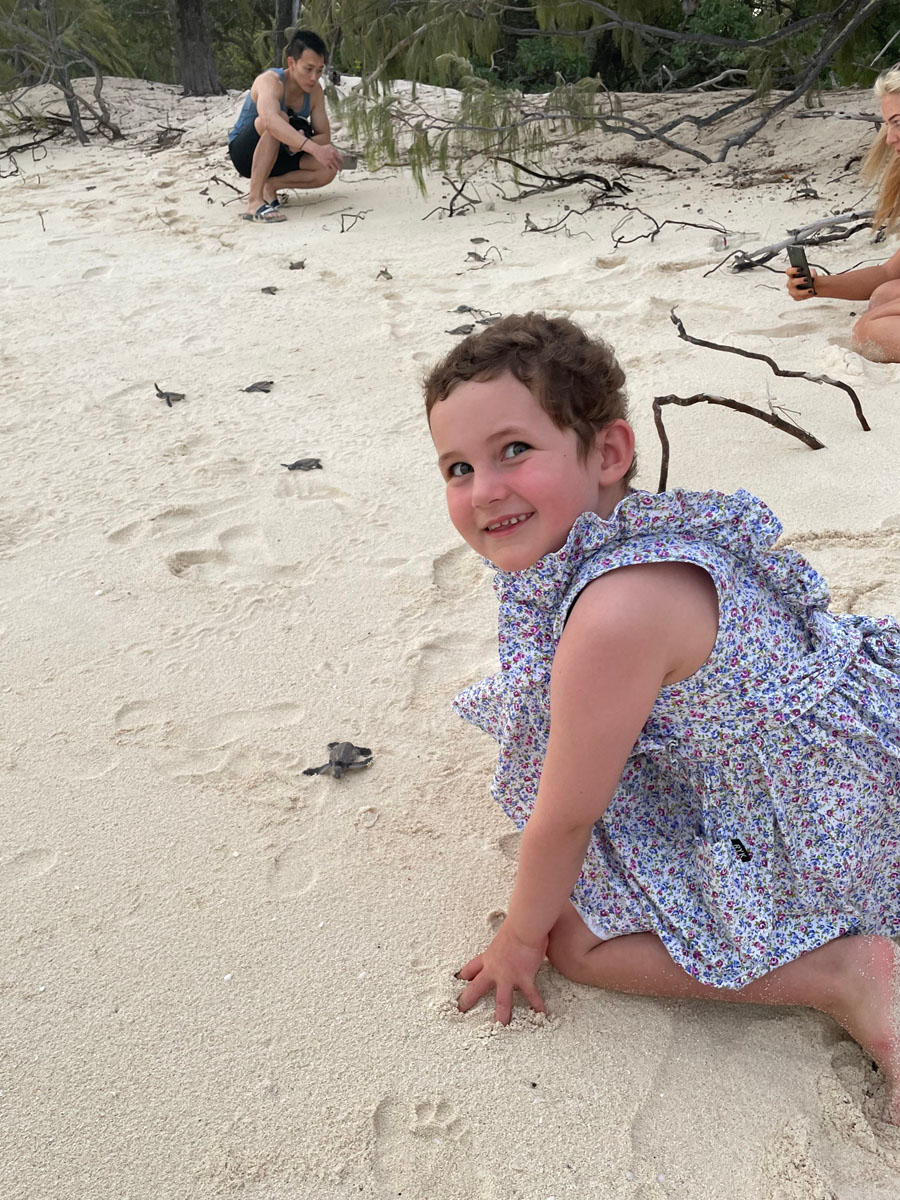 Molly watching baby turtles hatch for her Starlight Wish