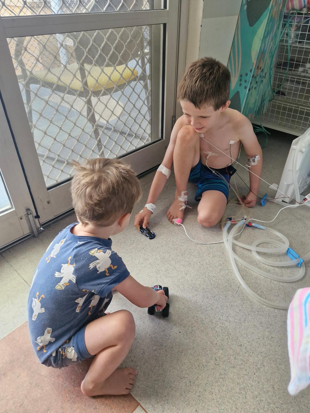 Desmond playing with brother