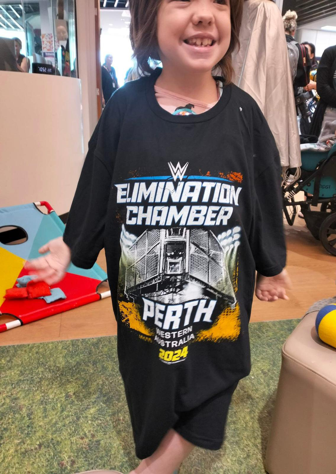 Amara wears an oversized sirt for WWE