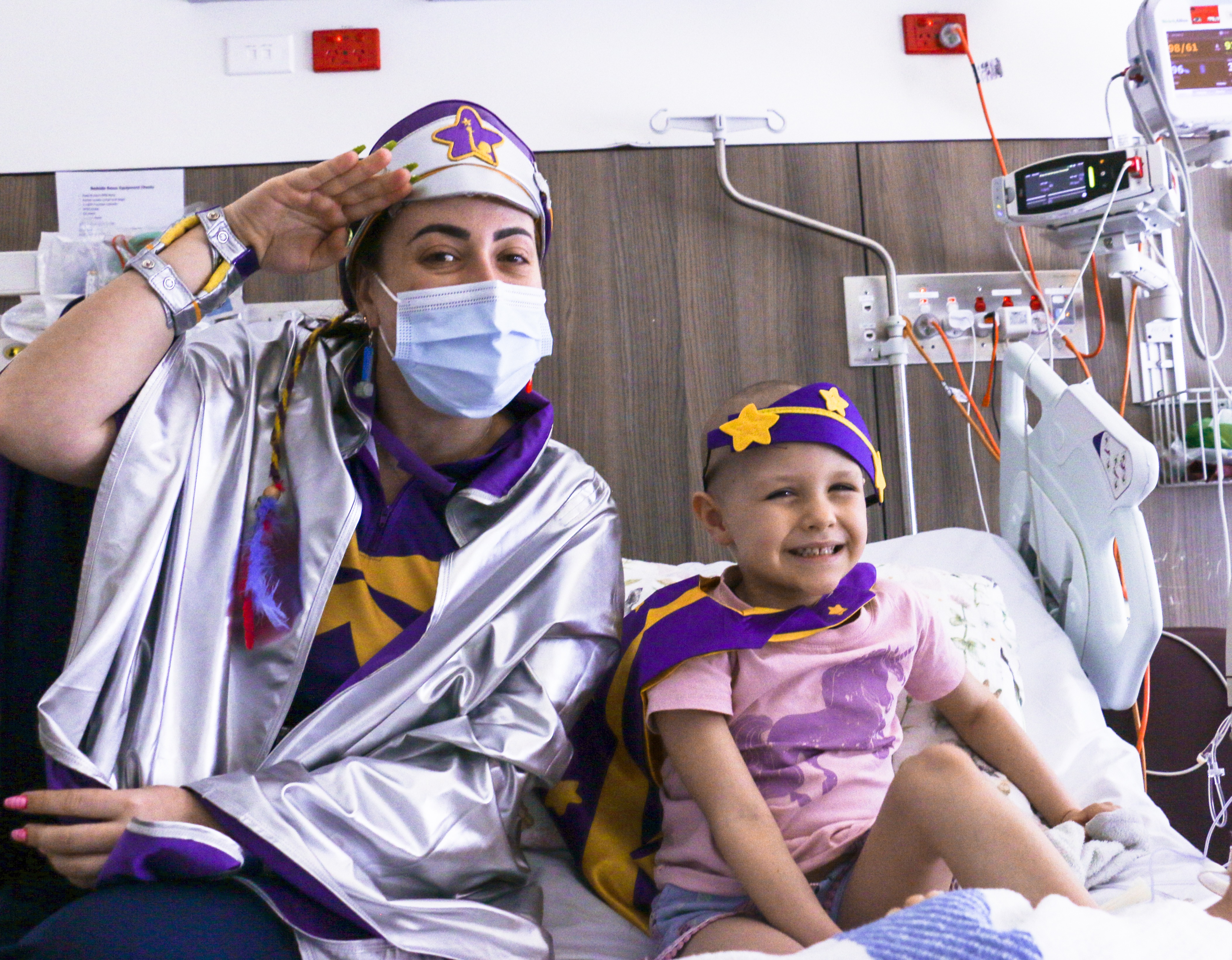 Savannah's story - Captain Starlight saluting on hospital bed