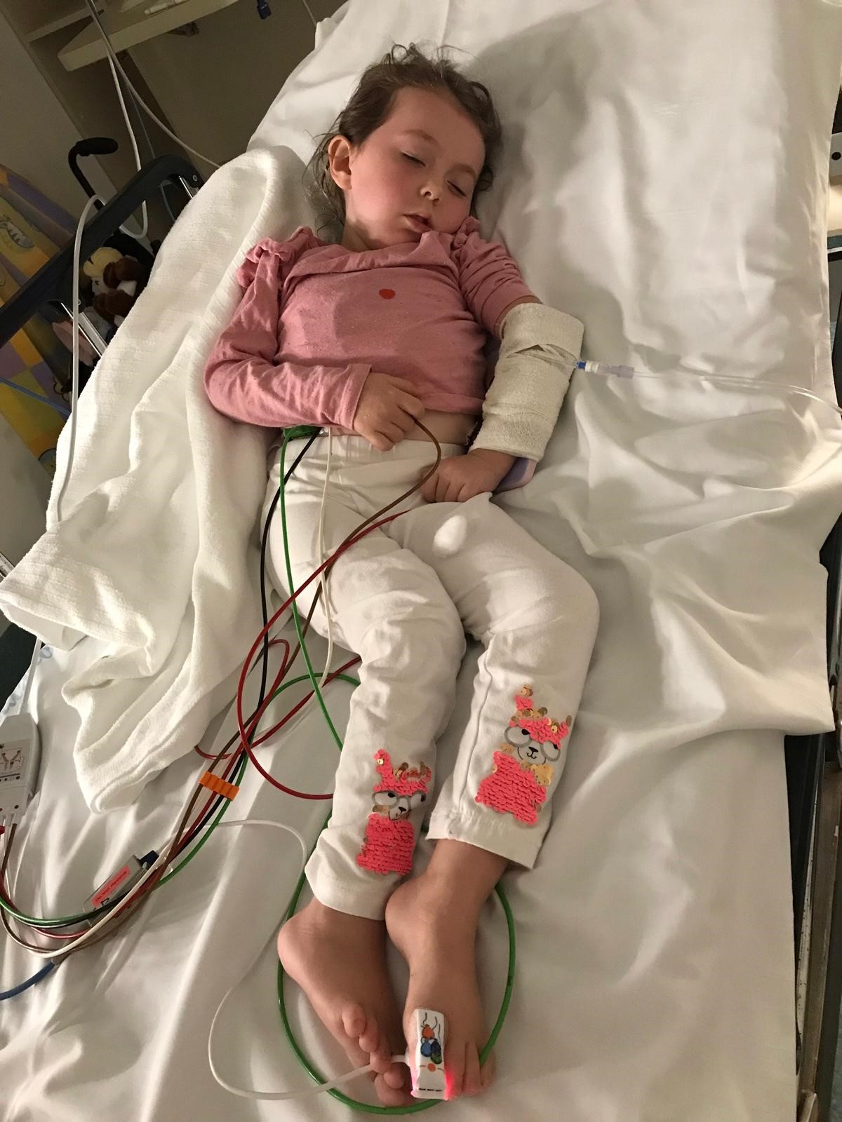 Avi sleeping in hospital bed