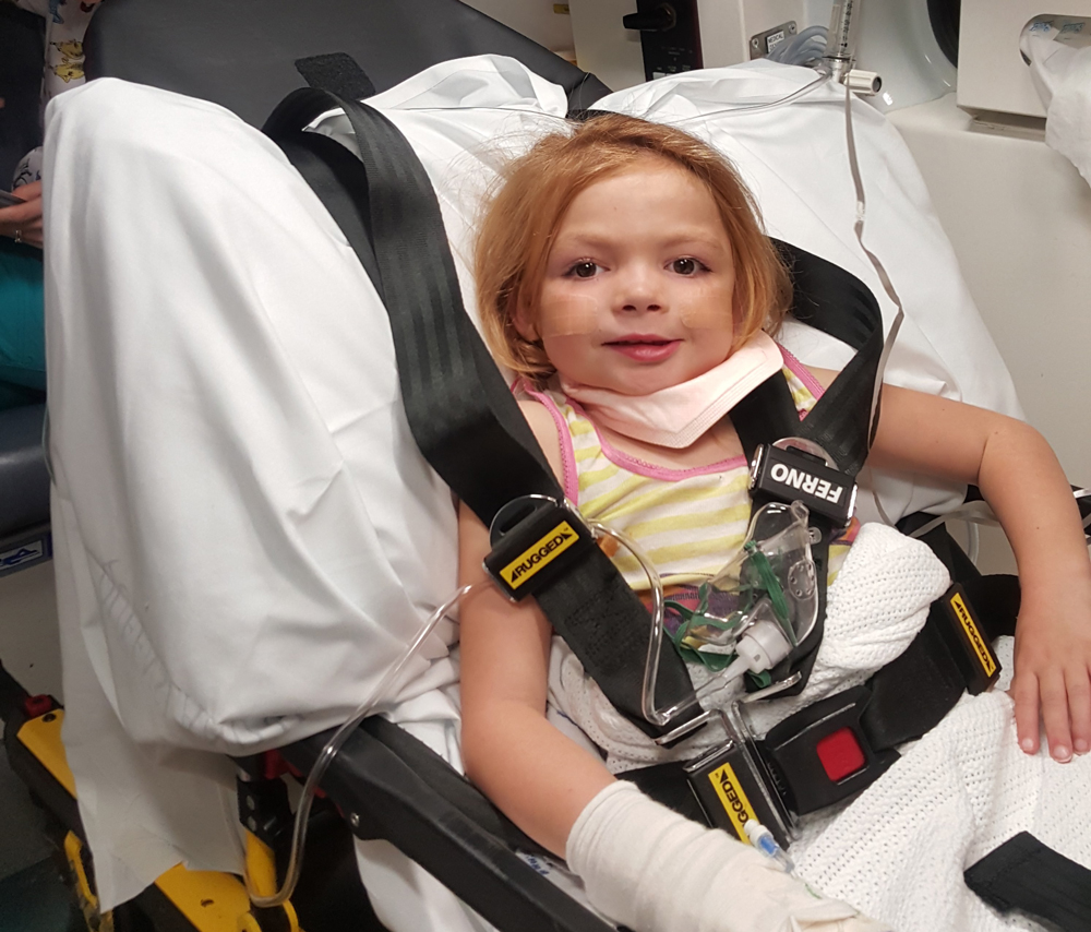 Nikiaya being transported to hospital