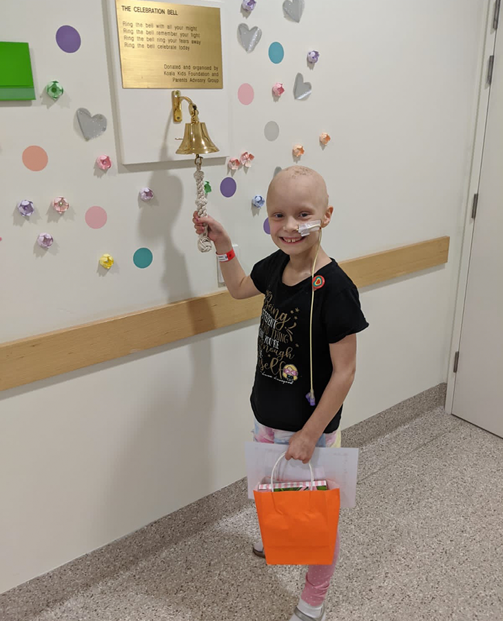 Bonnie ringing the celebration bell