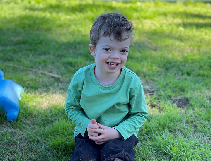Jagger sitting on grass - banner