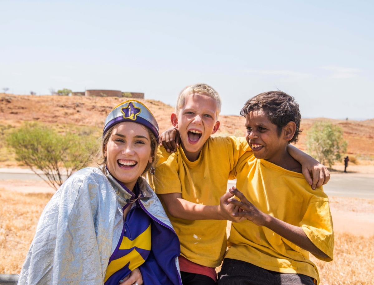 Captain laughing with school students edit