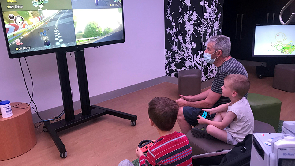 Luca playing video games in the Starlight Express Room