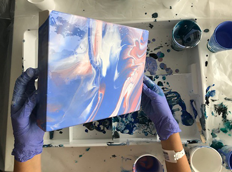 Livewire teen holding art