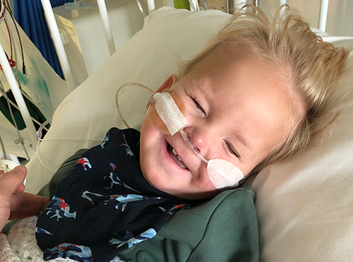 Winston smiling in hospital bed