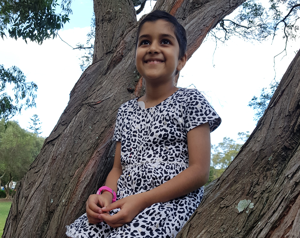 Ayla sitting in tree
